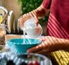 woman pouring a glass of milk